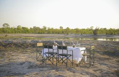 Experience dinner out in the open, with the sounds and views of the African bush
